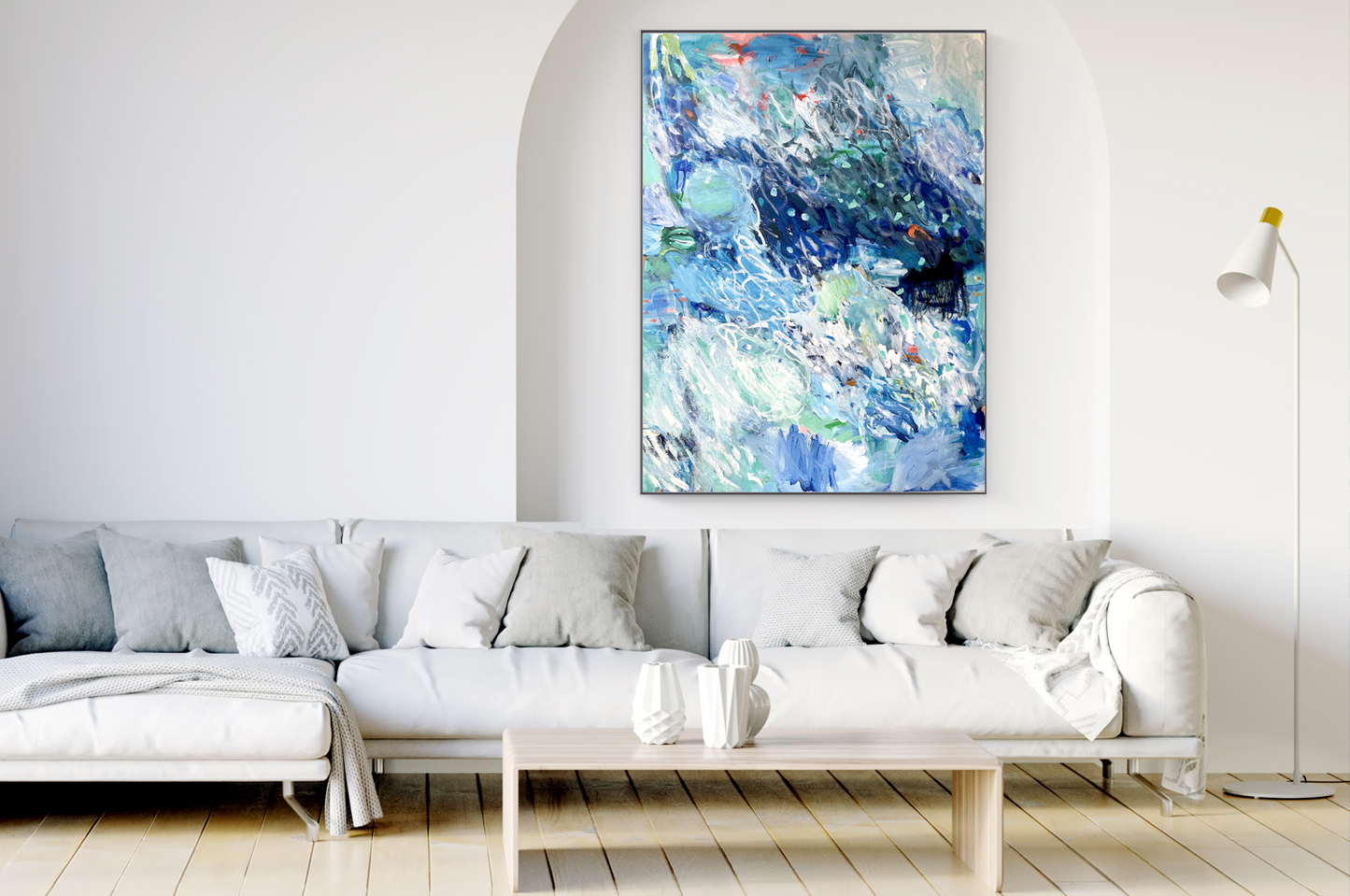 An ocean inspired abstract painting in the colours of blue, green and sparks of orange. Home decor. Interior design. Decorative art. Blue art. Affordable art. Lounge with art.