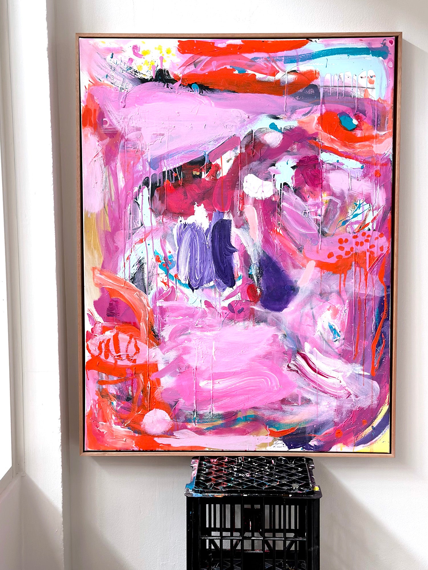 Pink abstract artwork. Bright artwork in artists studio. Home decor